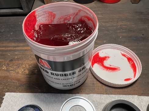 tub of rubber grease