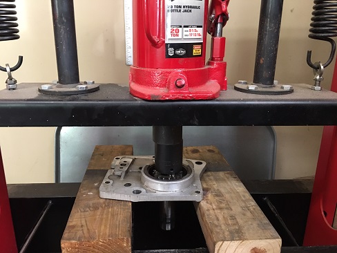 replace mainshaft bearing Ironhead transmission press fit mainshaft bearing into trap door