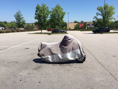 commuter motorcycle covered while parked at work Best Motorcycle Cover for outdoor use