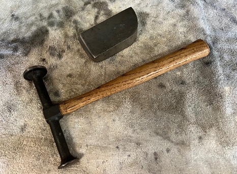 hammer and dolly to renew bolt holes in motorcycle fender