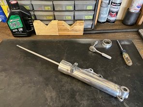 install damper rod assembly into slider replace motorcycle fork tubes