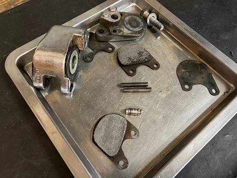 remove stuck piston from brake caliper